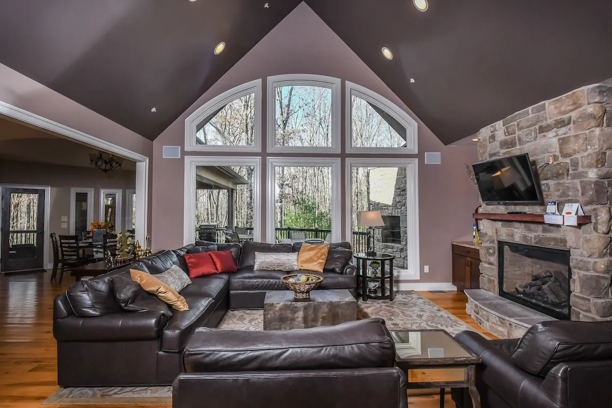 Living room with gas fireplace and comfortable seating at Woodland Chalet
