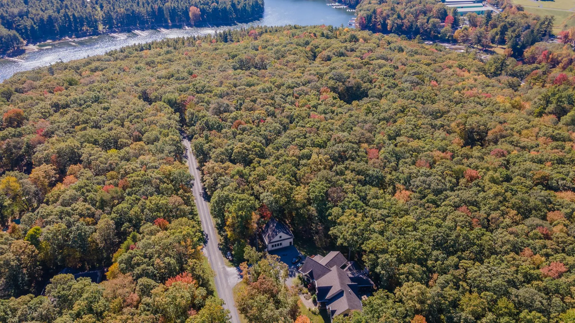 Aerial view of Woodland Chalet showing full property layout and wooded setting at Deep Creek Lake