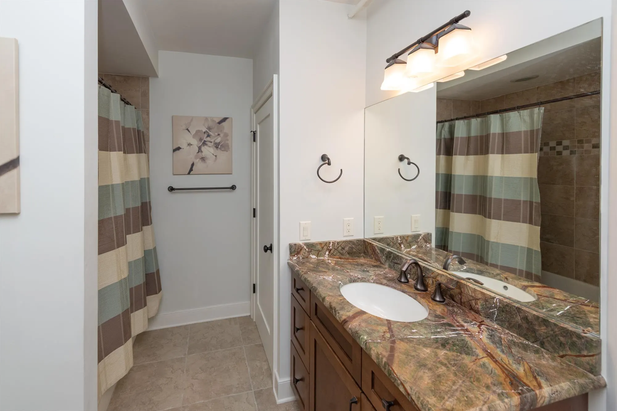 Lower level main bathroom accessible from the game room and common areas