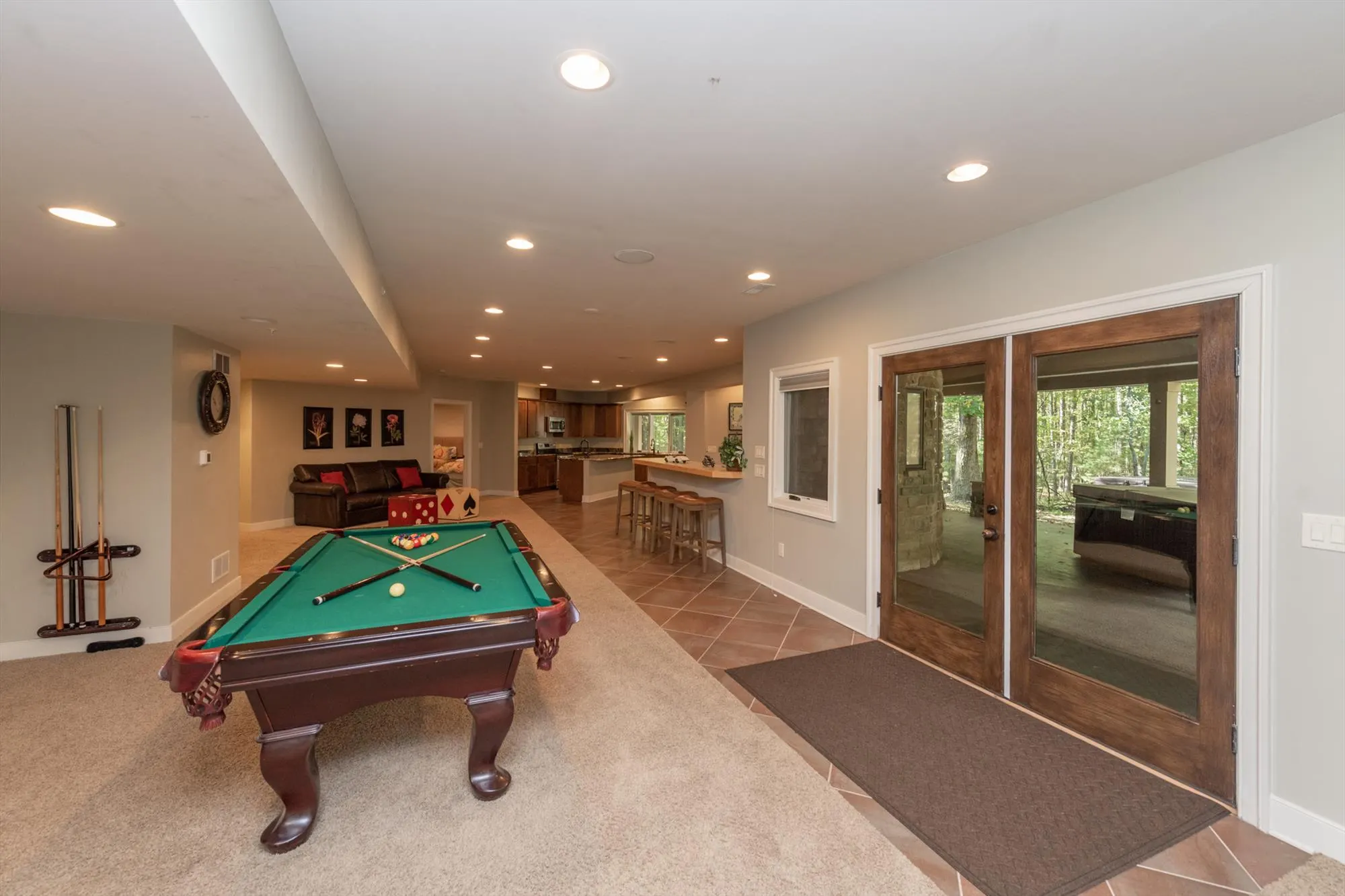 Game room alternate view showing the full 17-by-45-foot entertainment space