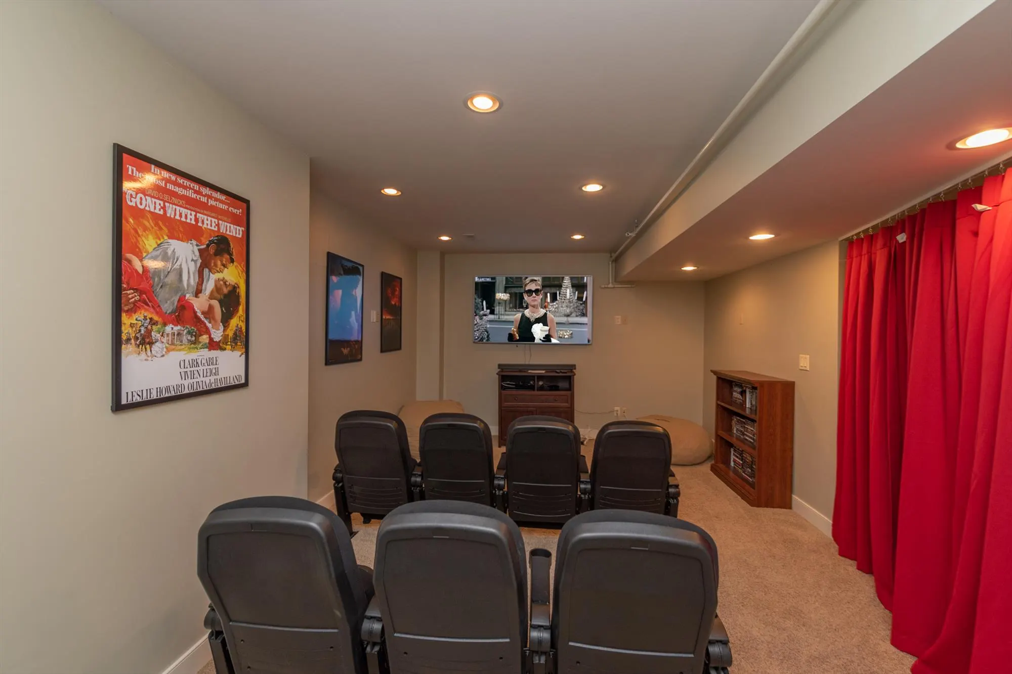 Theater room seating area with surround sound and Blu-ray player