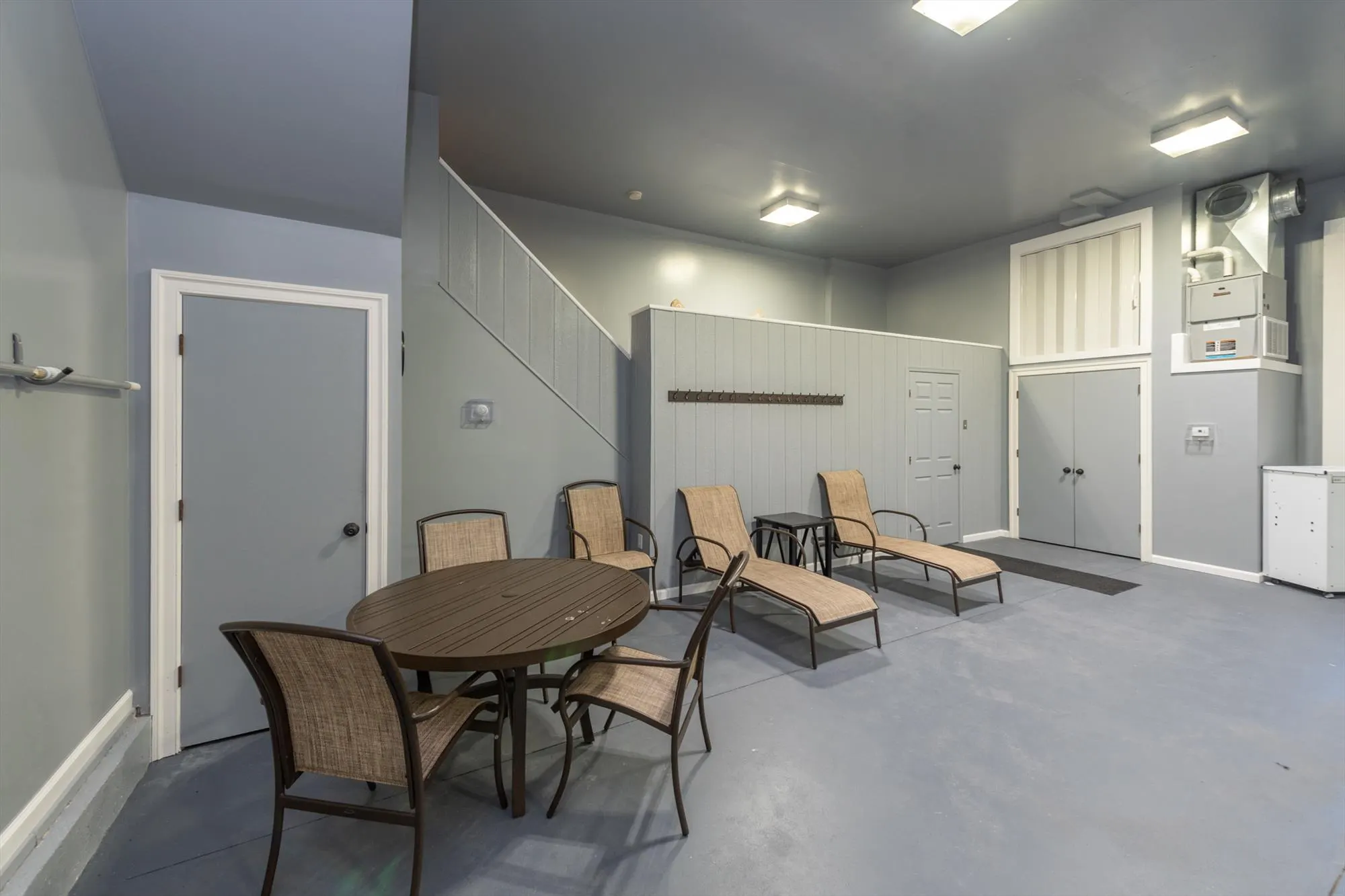 Alternate view of the heated indoor pool showing seating area and pool deck