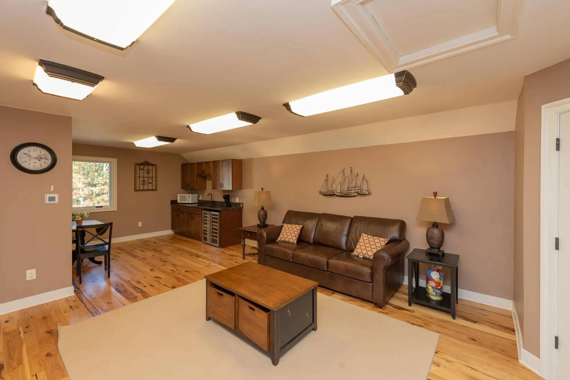 Pool house upper lounge with wet bar and relaxed seating for guests